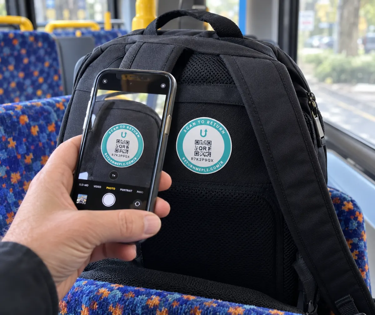 Scanning the ReturnMePlz tag on a backpack left on a bus seat